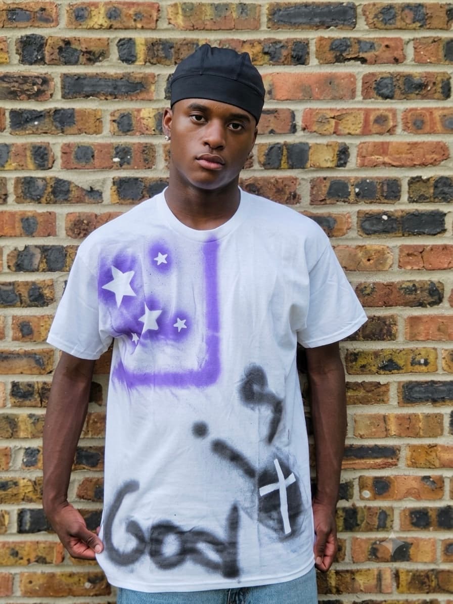 Design 11 — hand-sprayed tee, front